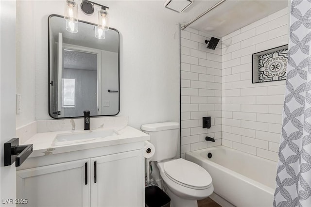 bathroom featuring vanity, shower / tub combo, and toilet