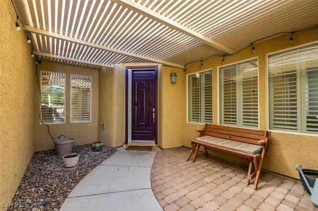7349 Royal Melbourne Dr, Las Vegas, NV 89131 - entrance to property featuring stucco siding and a pergola