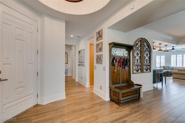7349 Royal Melbourne Dr, Las Vegas, NV 89131 - hallway with crown molding, recessed lighting, baseboards, and light wood-style flooring
