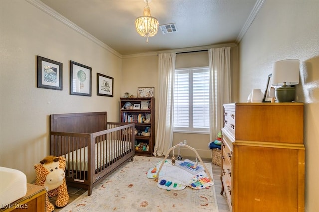 7349 Royal Melbourne Dr, Las Vegas, NV 89131 - bedroom with visible vents, a nursery area, baseboards, a notable chandelier, and ornamental molding