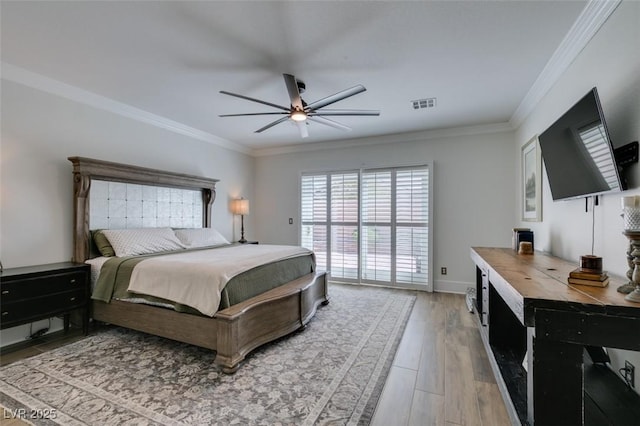 7349 Royal Melbourne Dr, Las Vegas, NV 89131 - bedroom featuring crown molding, a ceiling fan, light wood-type flooring, and visible vents