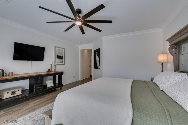 7349 Royal Melbourne Dr, Las Vegas, NV 89131 - bedroom featuring crown molding, a ceiling fan, baseboards, and wood finished floors