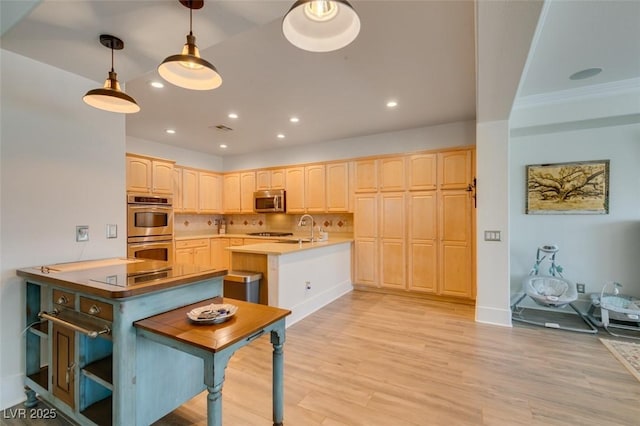 7349 Royal Melbourne Dr, Las Vegas, NV 89131 - kitchen featuring recessed lighting, light wood-style flooring, appliances with stainless steel finishes, and light brown cabinetry