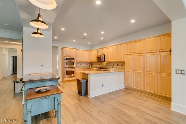 7349 Royal Melbourne Dr, Las Vegas, NV 89131 - kitchen with light brown cabinetry, stainless steel appliances, light wood finished floors, and a peninsula