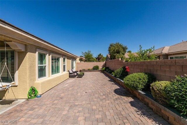 7349 Royal Melbourne Dr, Las Vegas, NV 89131 - view of patio with a fenced backyard