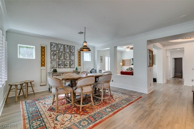 7349 Royal Melbourne Dr, Las Vegas, NV 89131 - dining room featuring visible vents, ornamental molding, baseboards, and wood finished floors