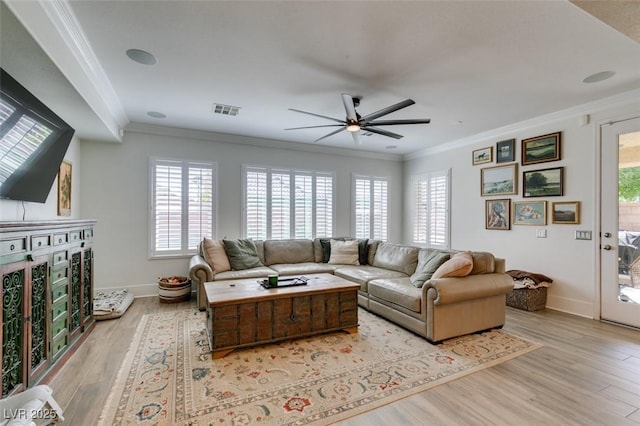 7349 Royal Melbourne Dr, Las Vegas, NV 89131 - living area featuring a healthy amount of sunlight, ornamental molding, and visible vents