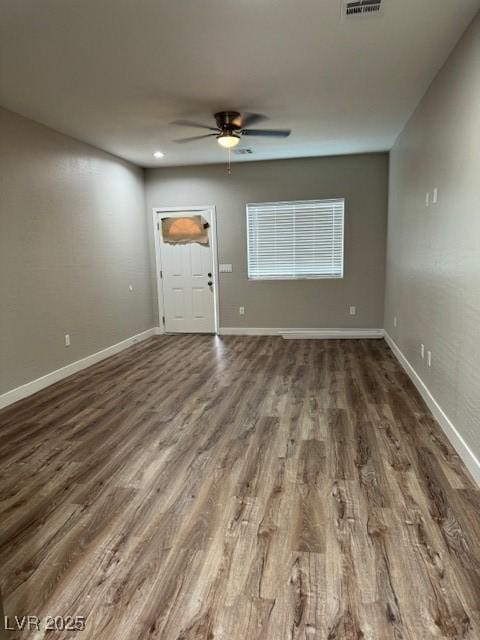 unfurnished living room with a ceiling fan, visible vents, wood finished floors, baseboards, and recessed lighting
