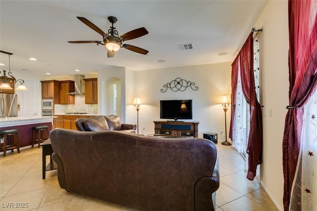living room with ceiling fan, recessed lighting, light tile patterned flooring, and visible vents