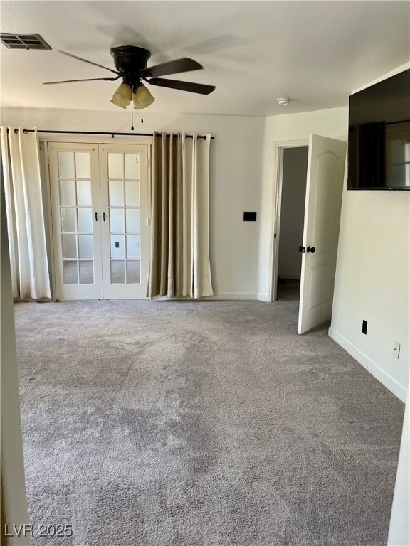 spare room with visible vents, baseboards, french doors, a ceiling fan, and carpet