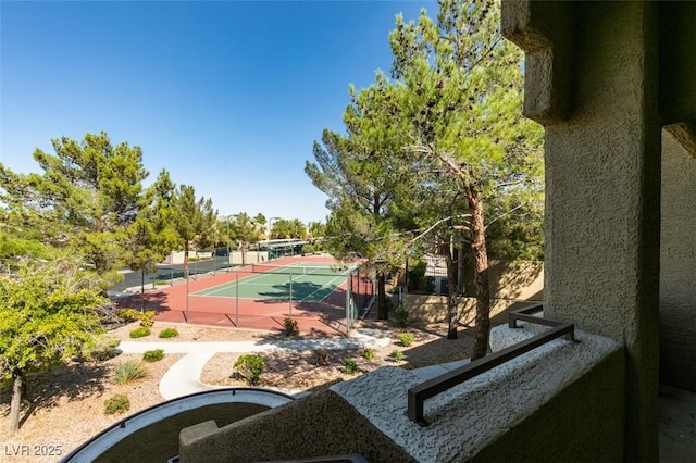 view of sport court with fence