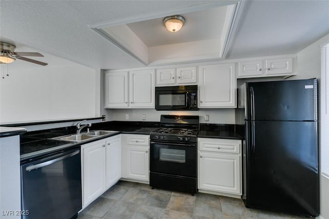kitchen featuring a ceiling fan, dark countertops, a sink, and black appliances