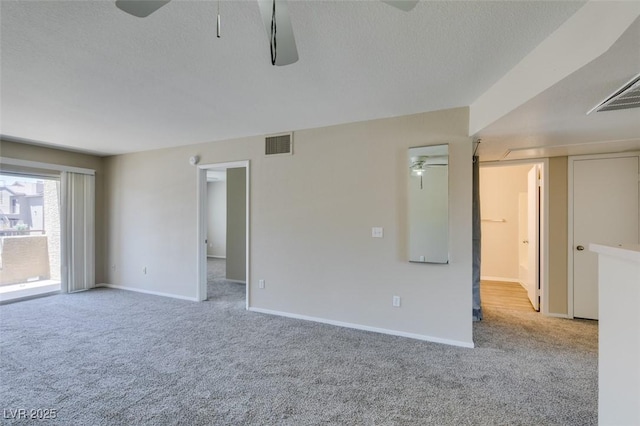 8070 W Russell Rd Unit 2121, Las Vegas, NV 89113 - carpeted empty room featuring a textured ceiling, baseboards, a ceiling fan, and visible vents