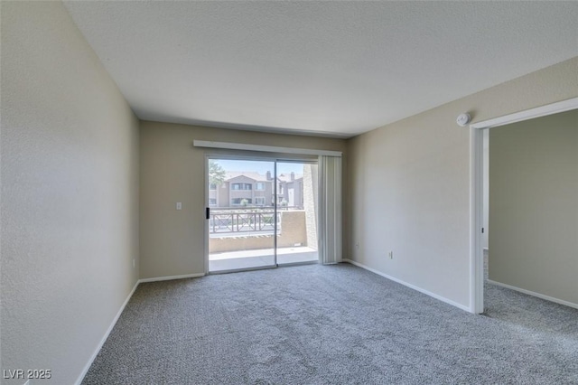 8070 W Russell Rd Unit 2121, Las Vegas, NV 89113 - empty room featuring carpet floors and baseboards