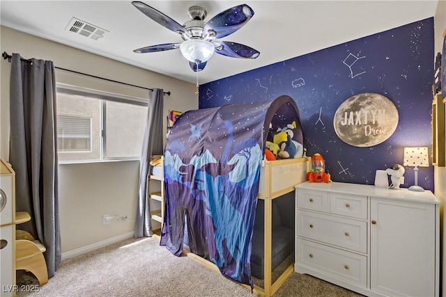 bedroom with carpet floors, ceiling fan, visible vents, and baseboards