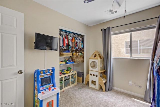 recreation room featuring baseboards, carpet, and visible vents