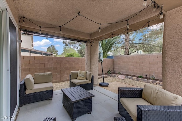 view of patio / terrace with a fenced backyard and outdoor lounge area