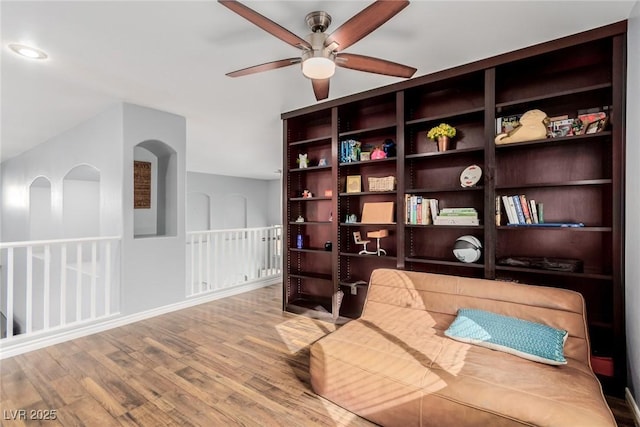 sitting room featuring ceiling fan and wood finished floors