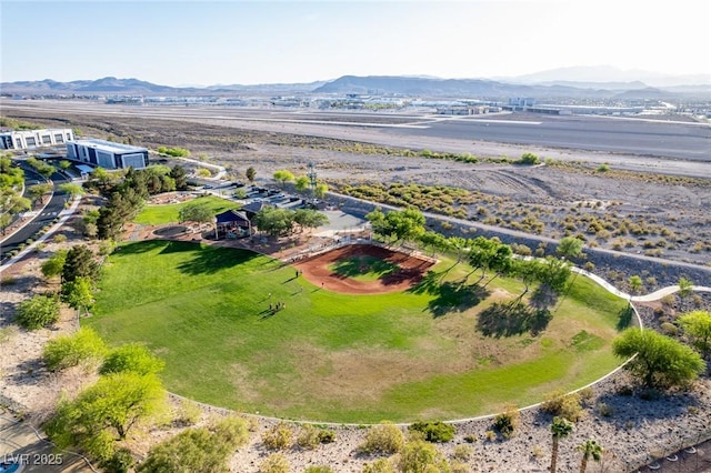 birds eye view of property with a mountain view