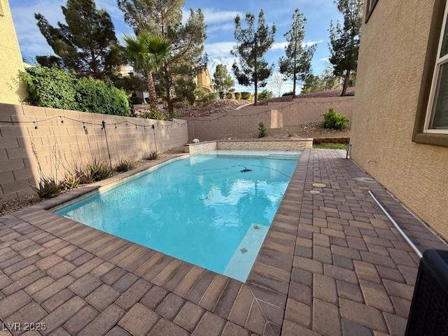 2947 Caxton Grove Dr, Henderson, NV 89052 - view of swimming pool featuring a fenced in pool, a fenced backyard, and a patio area