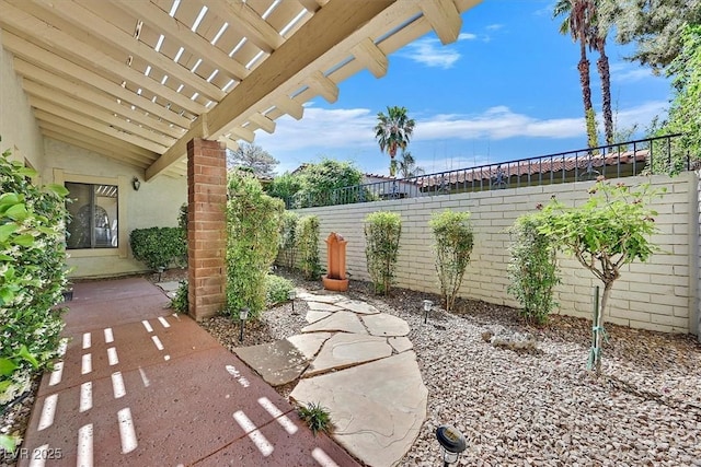 view of patio featuring fence