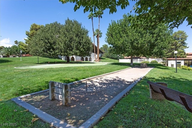 view of home's community with a yard