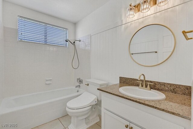 bathroom with vanity, washtub / shower combination, tile patterned flooring, and toilet