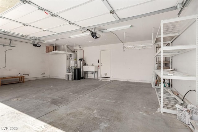 garage with a sink, water heater, and a garage door opener