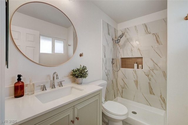 full bathroom featuring vanity, a marble finish shower, and toilet