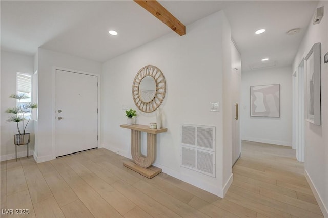 foyer entrance with visible vents, recessed lighting, and light wood-style flooring