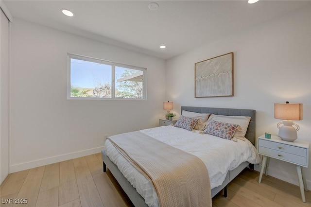 bedroom with recessed lighting, baseboards, and light wood-style floors