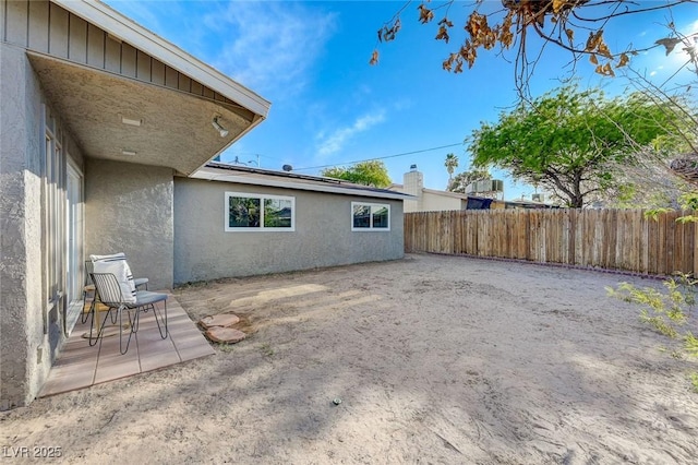 exterior space with fence and a patio area