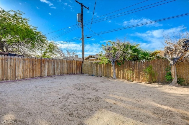 view of yard with a fenced backyard