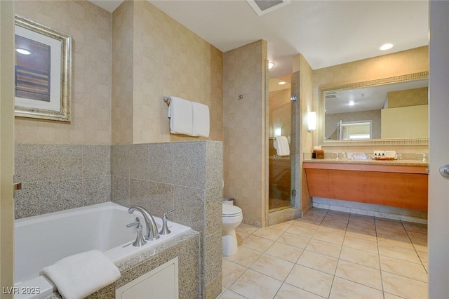full bath featuring visible vents, vanity, toilet, tile patterned floors, and a shower stall