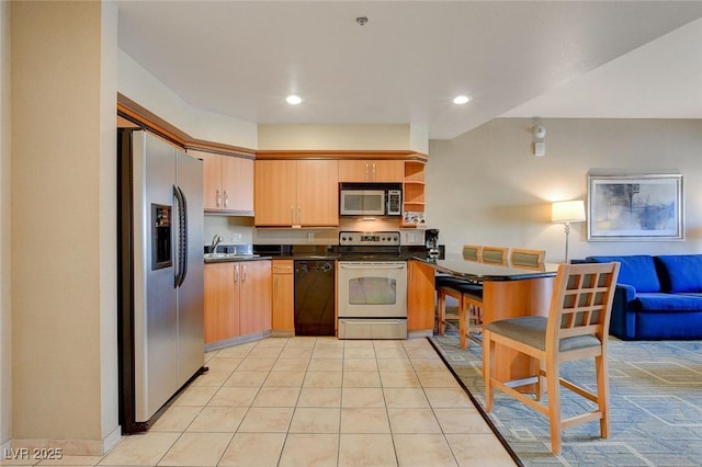 kitchen with open shelves, dark countertops, recessed lighting, a sink, and appliances with stainless steel finishes