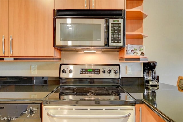 kitchen featuring dark countertops, open shelves, and stainless steel appliances
