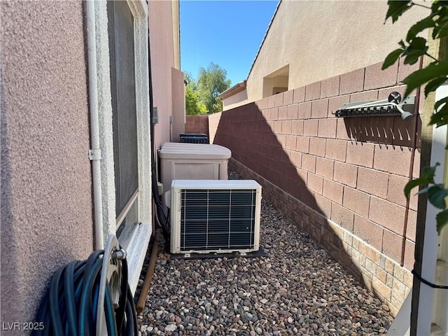 2312 Indigo Island St, Henderson, NV 89044 - details featuring central AC unit, stucco siding, and fence