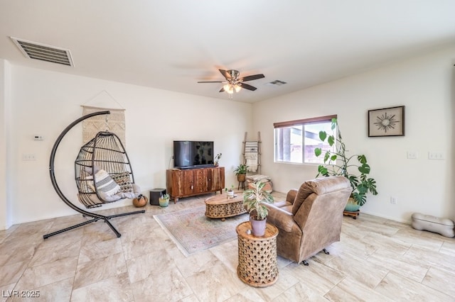living room with visible vents and ceiling fan