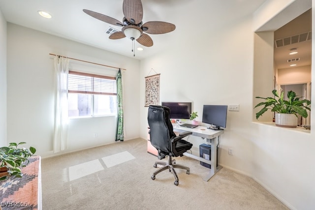 carpeted office space with a ceiling fan, visible vents, and recessed lighting