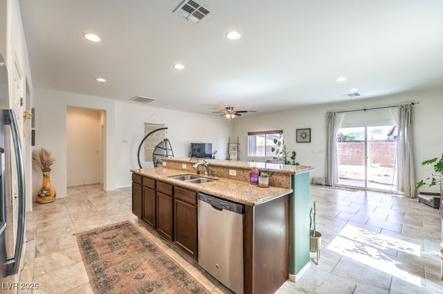 kitchen with ceiling fan, visible vents, fridge, dishwasher, and a sink