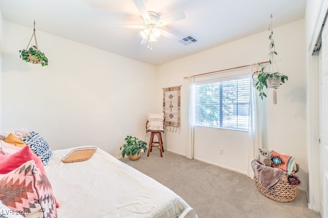 bedroom featuring visible vents, a ceiling fan, carpet, and baseboards