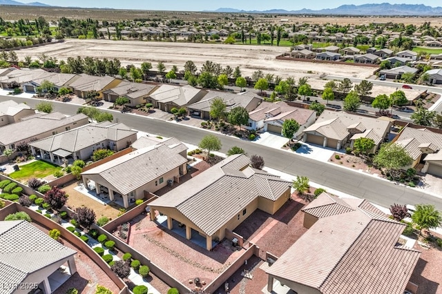aerial view featuring a mountain view and a residential view
