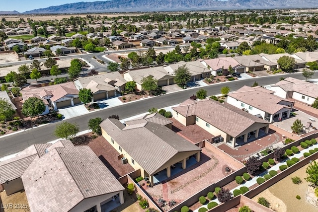aerial view featuring a mountain view and a residential view