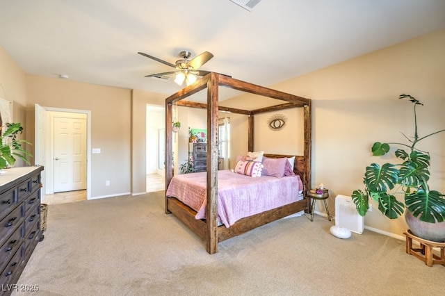bedroom featuring baseboards, light colored carpet, ceiling fan, and visible vents