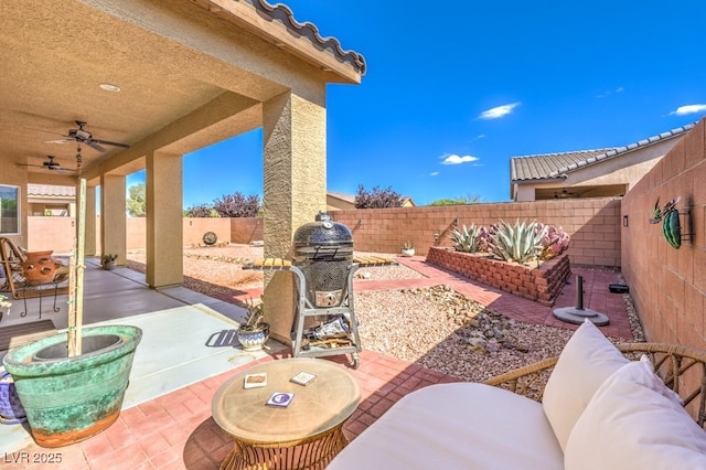 view of patio with ceiling fan and a fenced backyard