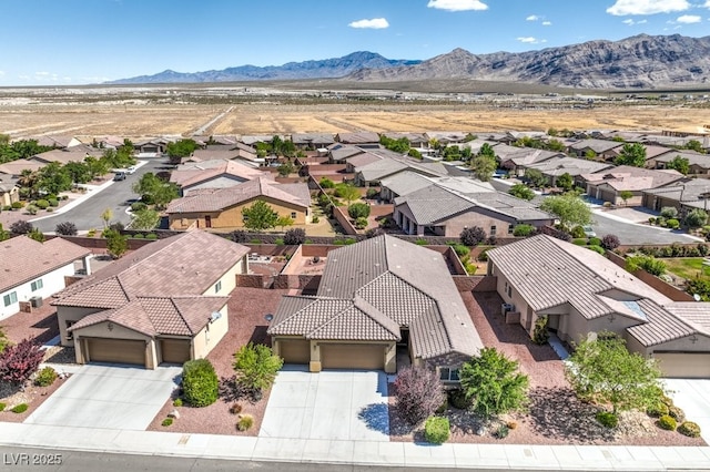 bird's eye view featuring a mountain view and a residential view