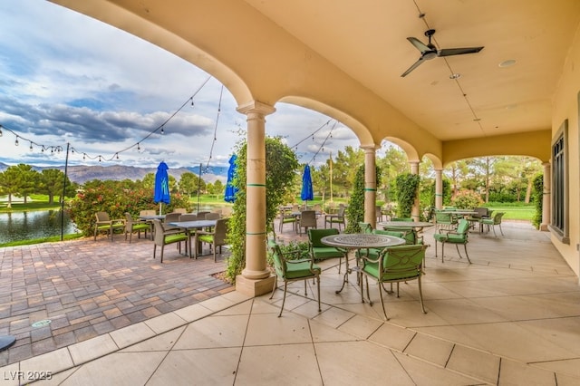 5500 E Volterra Dr, Pahrump, NV 89061 - view of patio / terrace with outdoor dining space and a water and mountain view