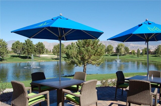 5500 E Volterra Dr, Pahrump, NV 89061 - dock area featuring outdoor dining area, a water and mountain view, and a yard