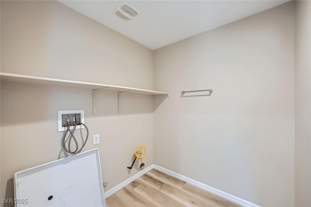 laundry room featuring laundry area, visible vents, hookup for a gas dryer, hookup for a washing machine, and light wood-style floors