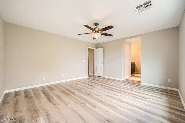 unfurnished bedroom featuring a ceiling fan, visible vents, baseboards, connected bathroom, and light wood-style floors